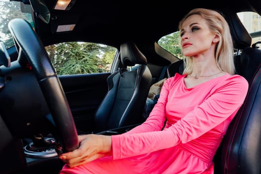 a travel driving woman driver behind the wheel of a car