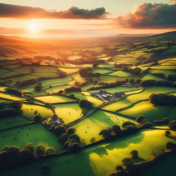 Aerial view of endless lush pastures and farmlands of Ireland. Beautiful Irish countryside with emerald green fields and meadows. Rural landscape on sunset.