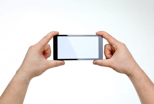 Male hand hoding smartphone isolated on white background. You can insert an image image of your text for the concept or project development of mobile applications and their advertising mobile devices