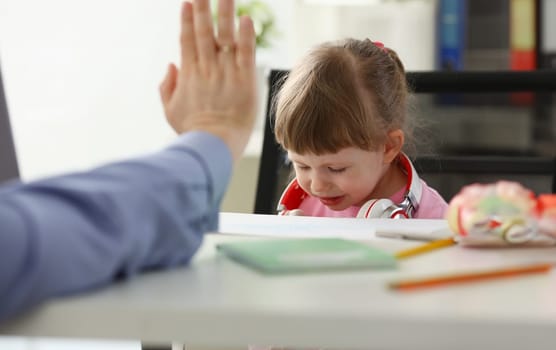 Father raised his hand to his daughter during the education concept