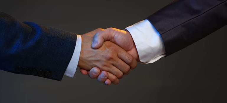 Man in suit shake hand as hello in office closeup. Friend welcome mediation offer positive introduction greet or thanks gesture summit participate approval background strike arm bargain concept