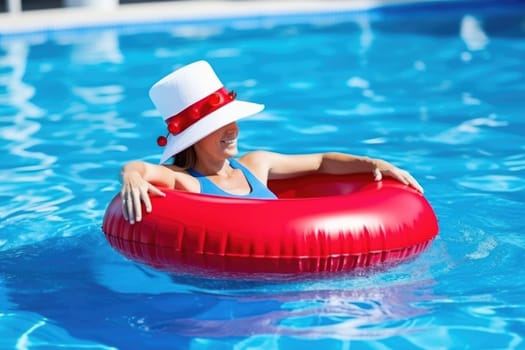 Christmas holidays on tropical destinations. woman in Santa Claus hat with inflatable ring relaxing in blue swimming pool. AI Generated