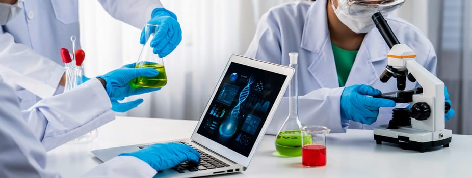 Laboratory research team advance healthcare with scientific expertise, laboratory equipment, and innovative medical biotechnology software, researching new medicines and developing cure.Panorama Rigid