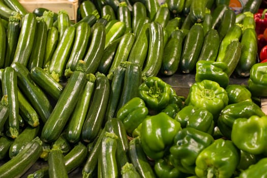green zucchini and peppers at the supermarket for sale