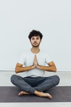 man does gymnastics warm-up exercises yoga asana