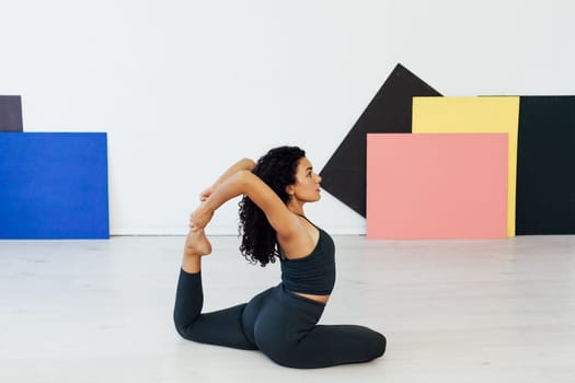 an exercises woman doing yoga relaxation classes stretching postures