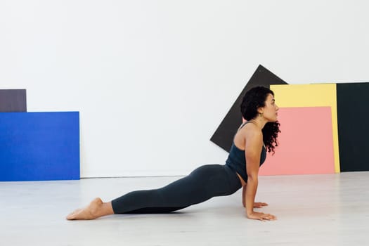 an exercises woman doing yoga relaxation classes stretching postures