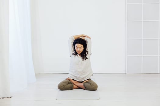 a woman doing yoga lotus pose relaxation exercises