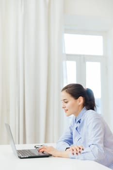 a woman communicates via skype with laptop at remote work internet conversation online communication