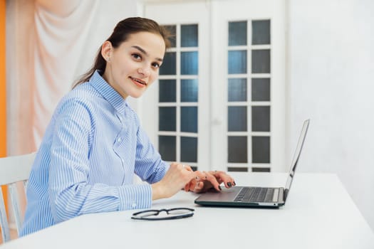 a woman with laptop at remote work internet conversation online communication communication