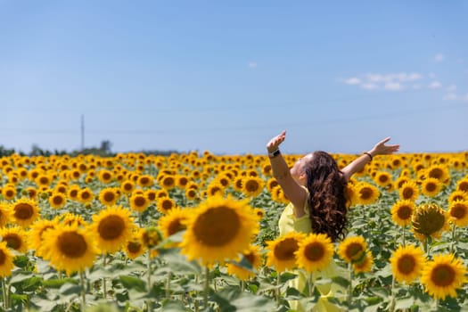 a woman with emotions in sunflowers journey nature