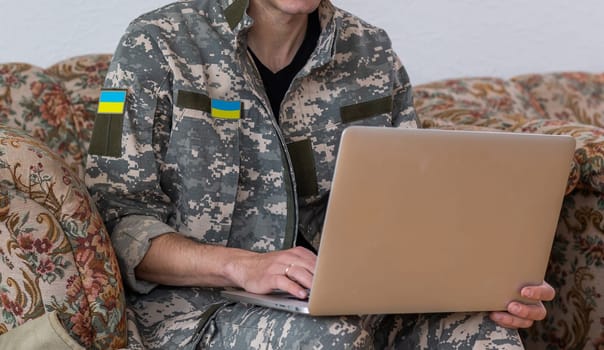 Ukrainian military man with a laptop.