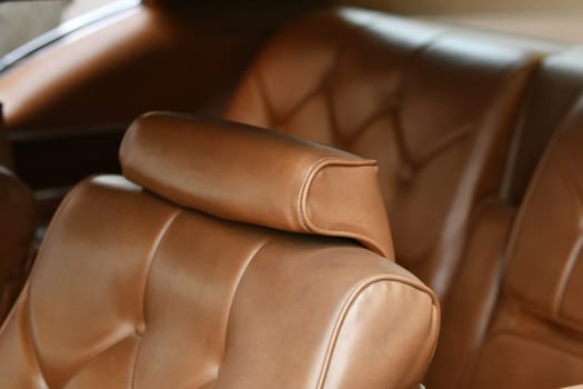 Brown vintage armchair in a car interior
