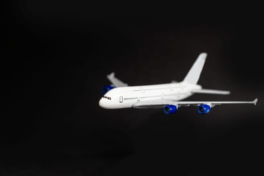 Airplane isolated on dark background.