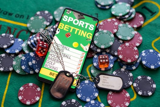 Army tokens, smartphone with sports betting.