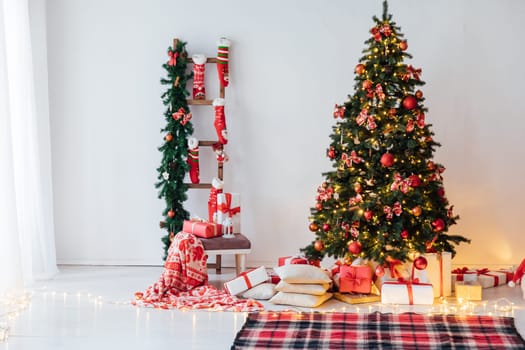 christmas tree with gifts and toys in interior