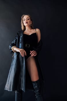 fashionable woman in latex clothes and high boots