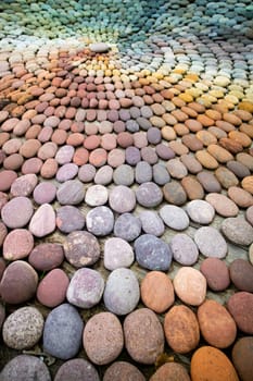 Photographic shot of the multicolor composition of a mosaic made of stones 