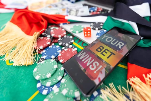 Gambling online casino Internet betting concept green screen. smartphone with poker chips, dice. Jackpot, casino chips. High quality photo