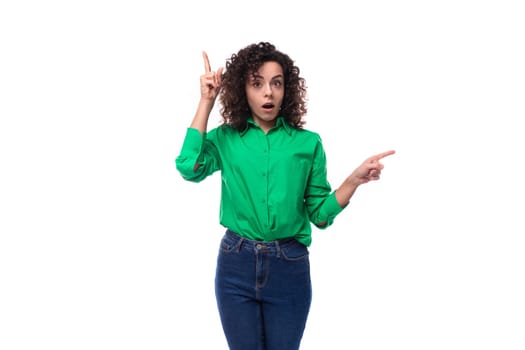 cute young woman with black curly hair dressed in a green shirt is inspired by the idea.