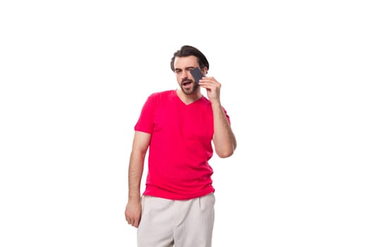 young brunette advertiser man holding plastic credit card.