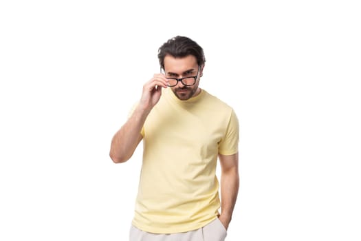 young smart leader european man with beard and mustache dressed in t-shirt wear glasses for image.