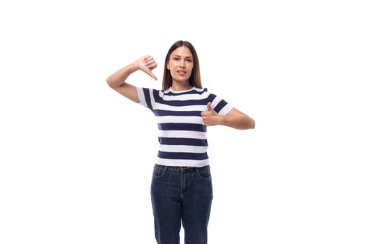 slim young caucasian brunette promoter woman in a striped black and white t-shirt on a white background.