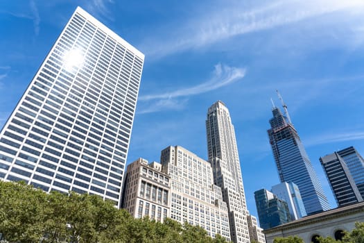 New York, United States of America - September 20, 2019: Skyscrapers as seen from Bryant Park in Manhattan.