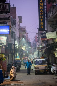 Delhi, India - December 05, 2019: Street at Main Bazaar in Paharganj district at early morning.