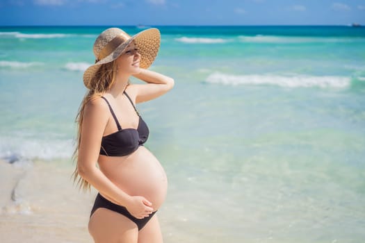 Radiant and expecting, a pregnant woman stands on a pristine snow-white tropical beach, celebrating the miracle of life against a backdrop of natural beauty.