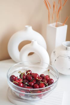 ripe fresh cherry in a bowl on table .