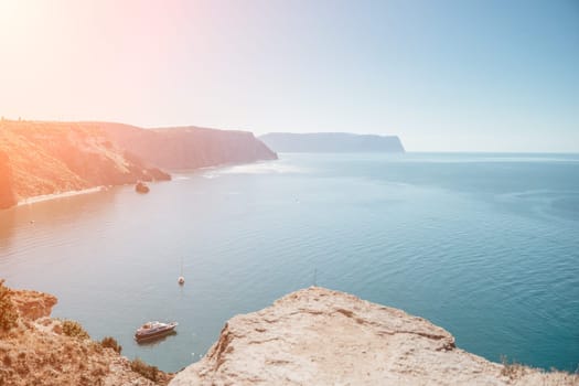 Aerial panoramic view of beautiful sunset above sea. Beautiful seascape. Sun glare, small waves on the water surface. Evening. Horizon. Nobody. No people. Copy space. Never-ending beauty of nature