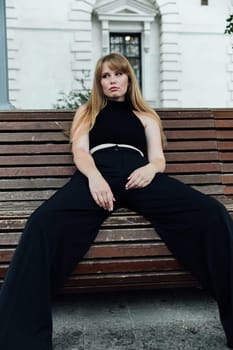 Portrait of a beautiful woman in black camsuits outdoors