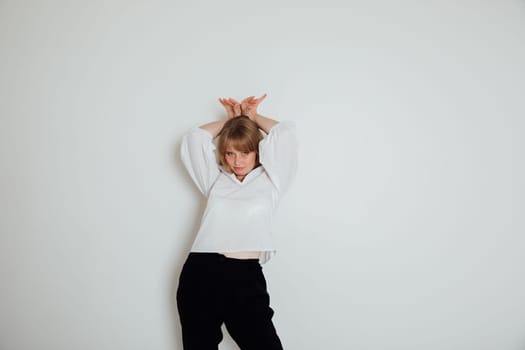 young woman showing bunny ears with her hands