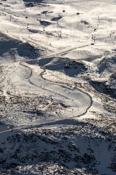 front view of ski slope, with people skiing, in sierra nevada ski resort,granada,