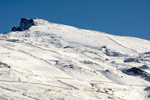 Sierra Nevada, Spain, a mountain range in Spain. It is a popular tourist destination, as its high peaks make skiing possible in one of Europe's most southerly ski resorts