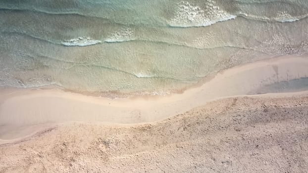 aerial view from drone of a natural paradise beach in the mediterranean, with crystal clear water and white sand. sa Coma Mallorca, Balearic Islands