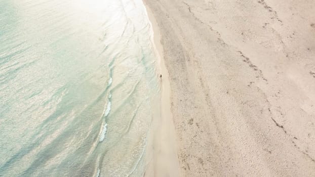 aerial view from drone of a natural paradise beach in the mediterranean, with crystal clear water and white sand. sa Coma Mallorca, Balearic Islands