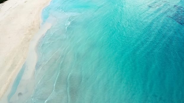 aerial view from drone of a natural paradise beach in the mediterranean, with crystal clear water and white sand. sa Coma Mallorca, Balearic Islands