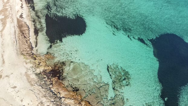 aerial view from drone of a natural paradise beach in the mediterranean, with crystal clear water and white sand. calamillor, Mallorca, Balearic Islands