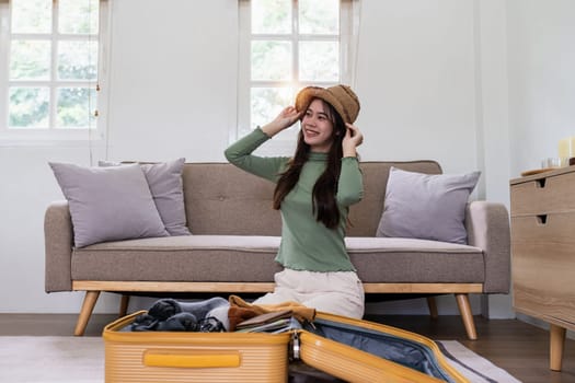 Woman packing a suitcase for a new travel trip. bag and luggage for journey.