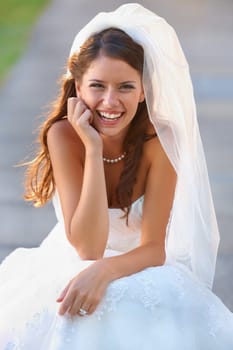 Bride, woman and portrait with smile for wedding, ceremony or celebration outdoor in nature for commitment. Marriage, person and face with dress, joy or happy for event, unity and romance in park.