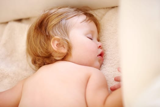 Closeup, baby and face for sleep on bed from good dream, nap or rest in nursery. Toddler, relaxing or peaceful on pillow, blanket or cozy for child growth, tired or development for future in home.