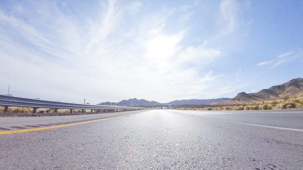 Embarking on a road trip from Nevada to California, driving on Highway 15 during the day offers scenic views and an exciting journey between states.