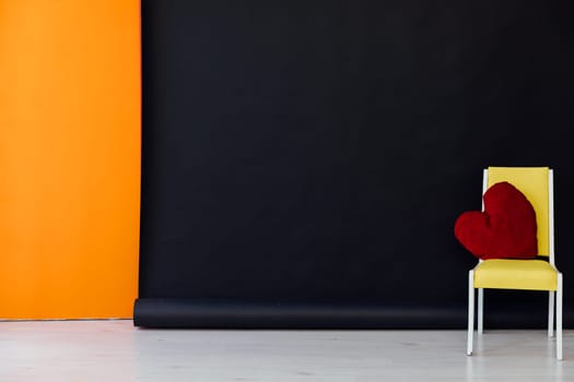 chair in the interior of a black and orange room