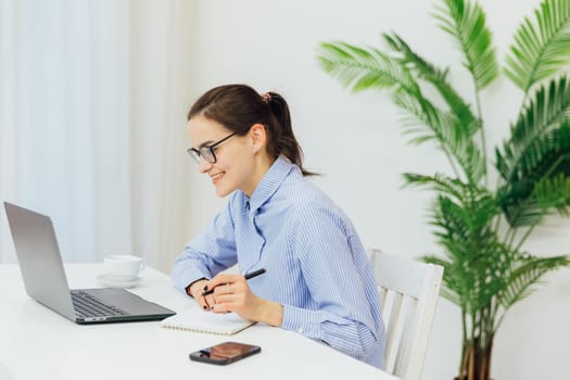 Smiling caucasian young businesswoman bank employee worker manager boss ceo looking at camera, using laptop for distant education work, e-learning, watching webinars online isolated in white