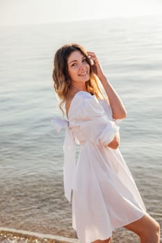 Woman on a walk near the sea on the shore