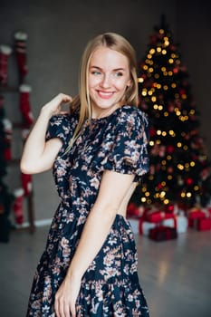 blonde woman posing in a room with a Christmas tree Christmas holiday