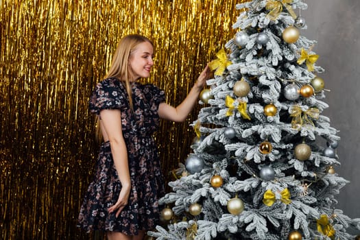 beautiful blonde near the Christmas tree, New Year,