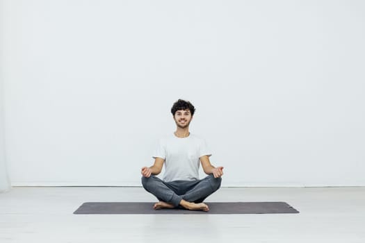 man doing yoga exercises meditation asana lotus
